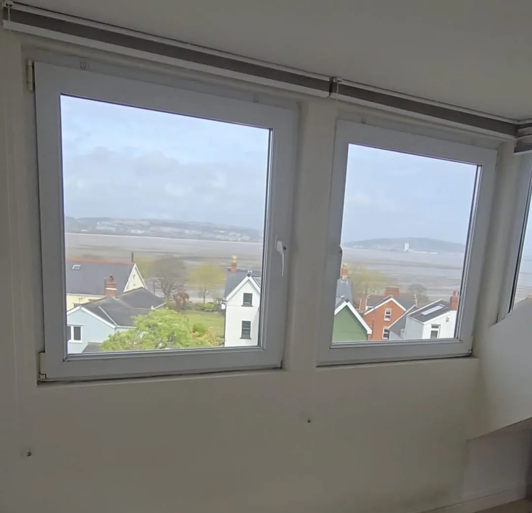 Dormer windows fitted with Active Trickle Vents in a loft bedroom