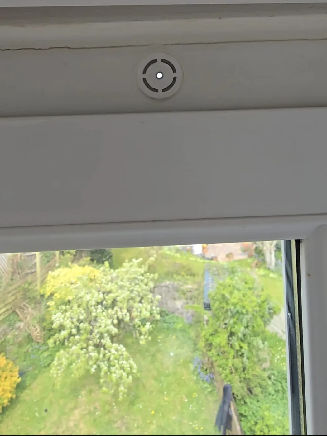 Close-up of the Active Trickle Vent fitted at the head of a bedroom window